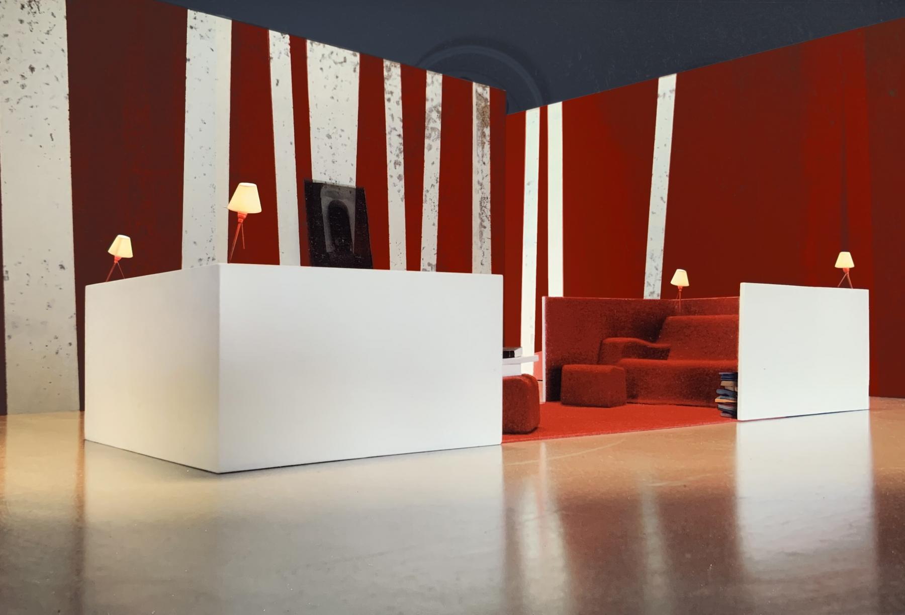 2 canapés 3 places sont positionnés face à face et reliés par un tapis rouge. Ils peuvent see rapprocher pour former un salon fermé. Jérôme Barrier éditions.